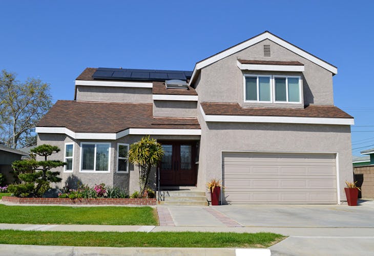 A wonderful two storey cottage with solar panels on the roof. Artesia,CA.